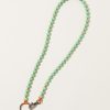 Accessories Ina Seifart | Perlen Long Keyholder In Pastel Green On Orange